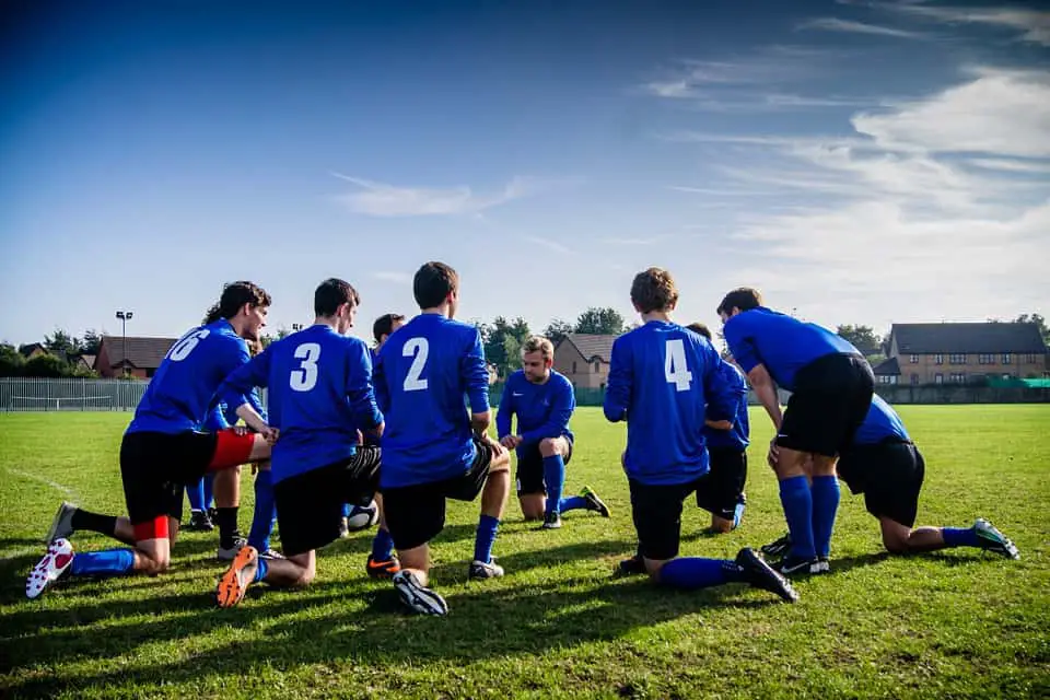 soccer team huddled together