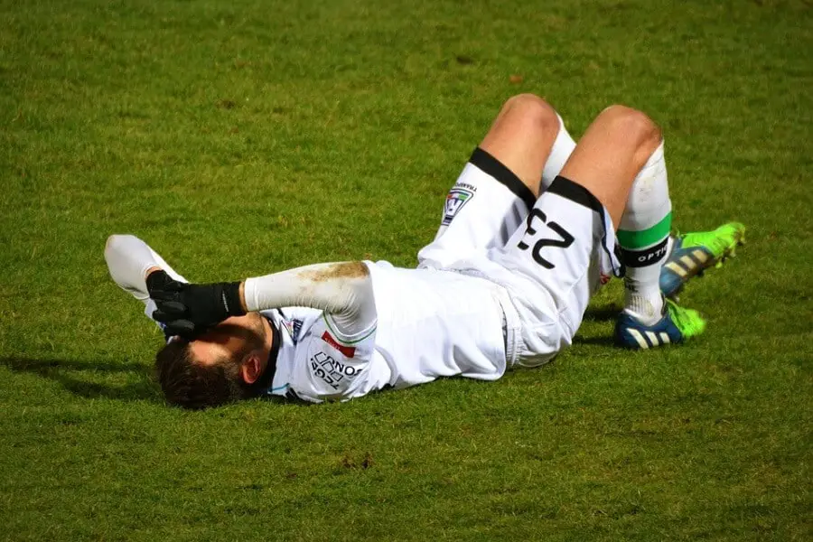 football player on the field looking injured