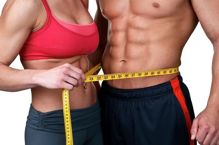 slim and fit man and woman in training attire