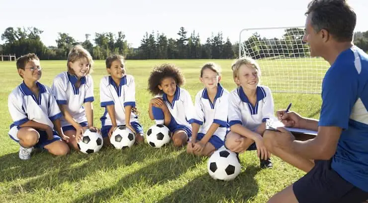 football coach with young players