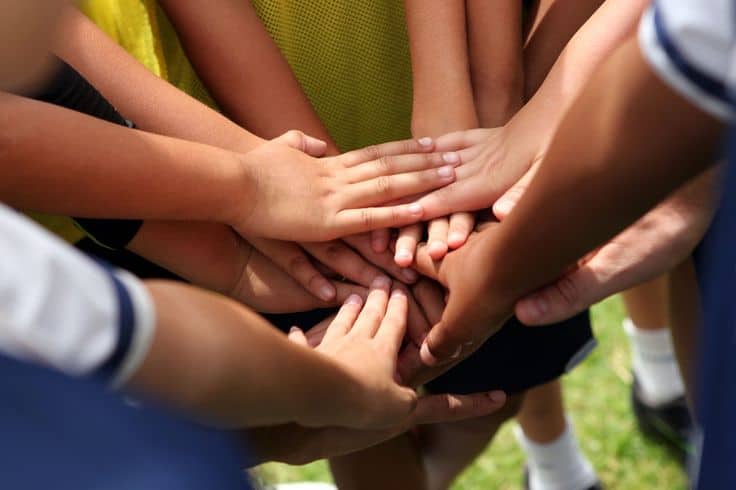 gathering hands in the huddle