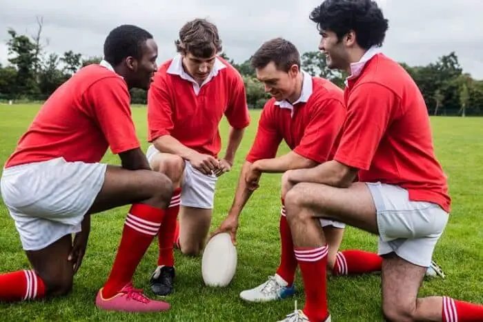 rugby players discussing