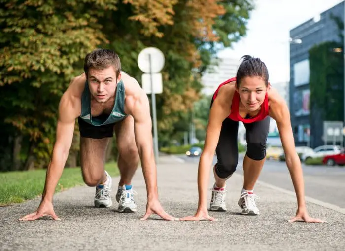 young couple competing in running